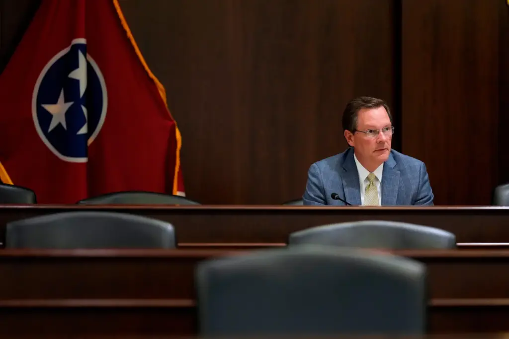 House Speaker Cameron Sexton sits alone after a House committee meeting.