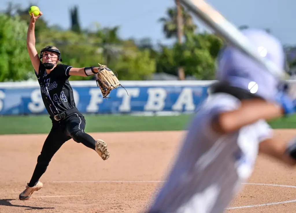 Pacifica relief pitcher Kenzie Bledl throws to home plate during...