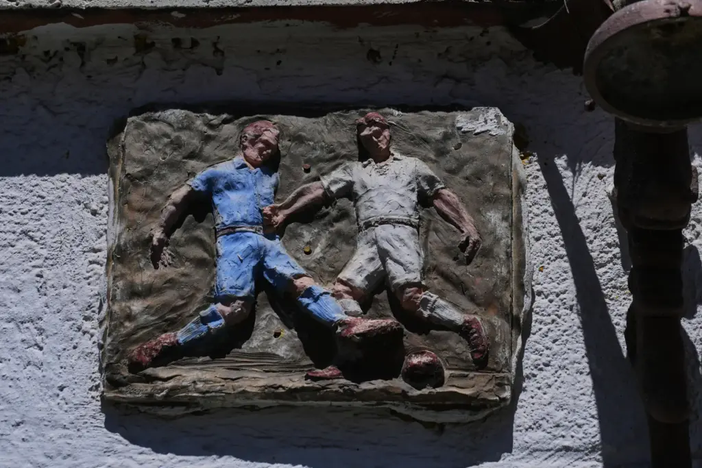Art dedicated to soccer hangs on the wall