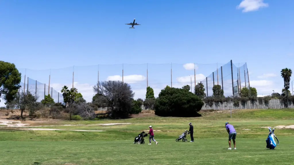 Golfers play on hole 7 at Newport Beach Golf Course...