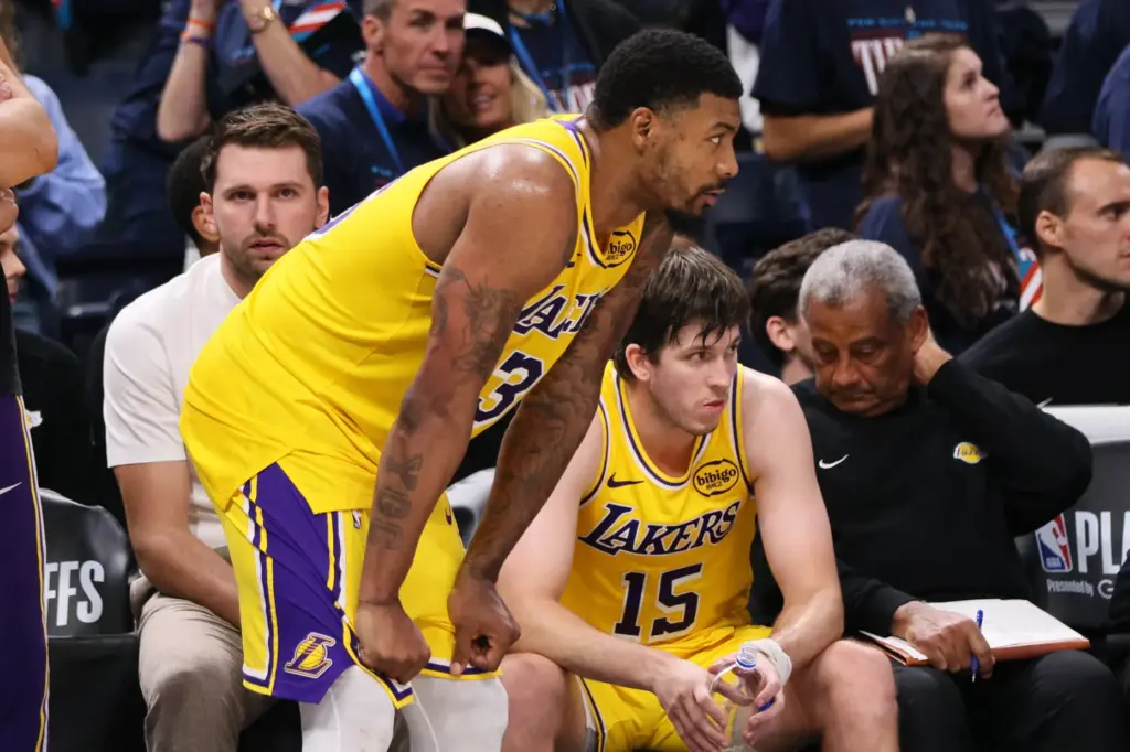 Los Angeles Lakers’ Marcus Smart, center, Luka Doncic, left rear,...