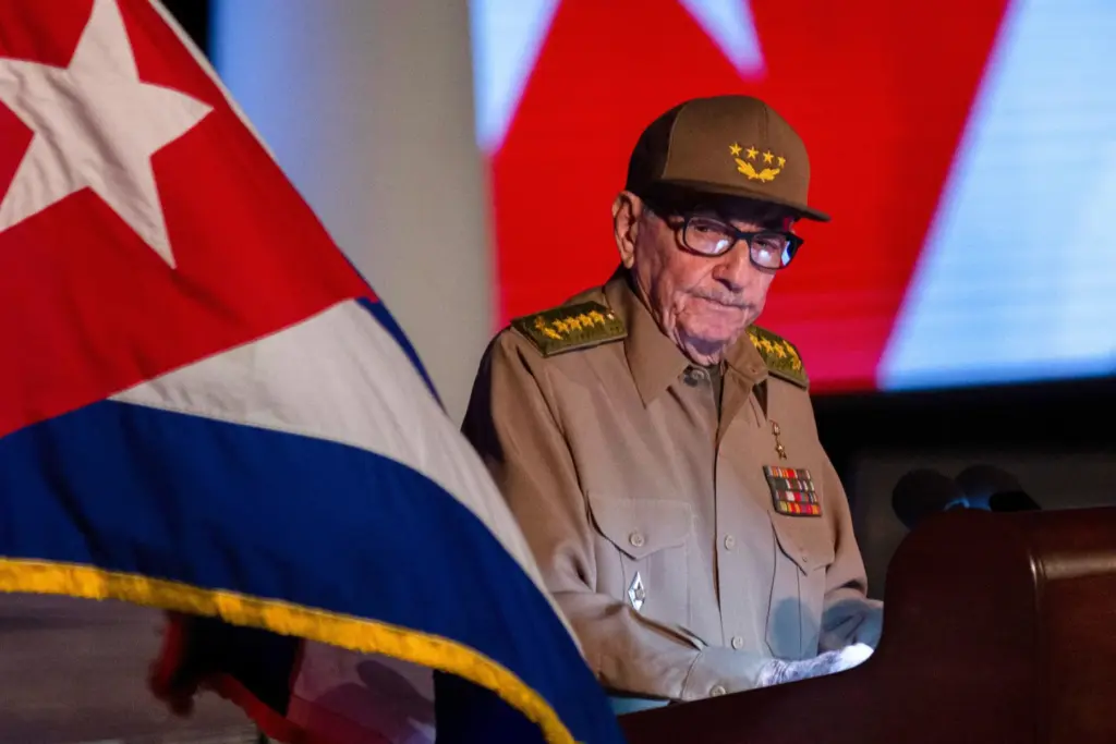FILE – Former Cuban President Raul Castro looks at the...