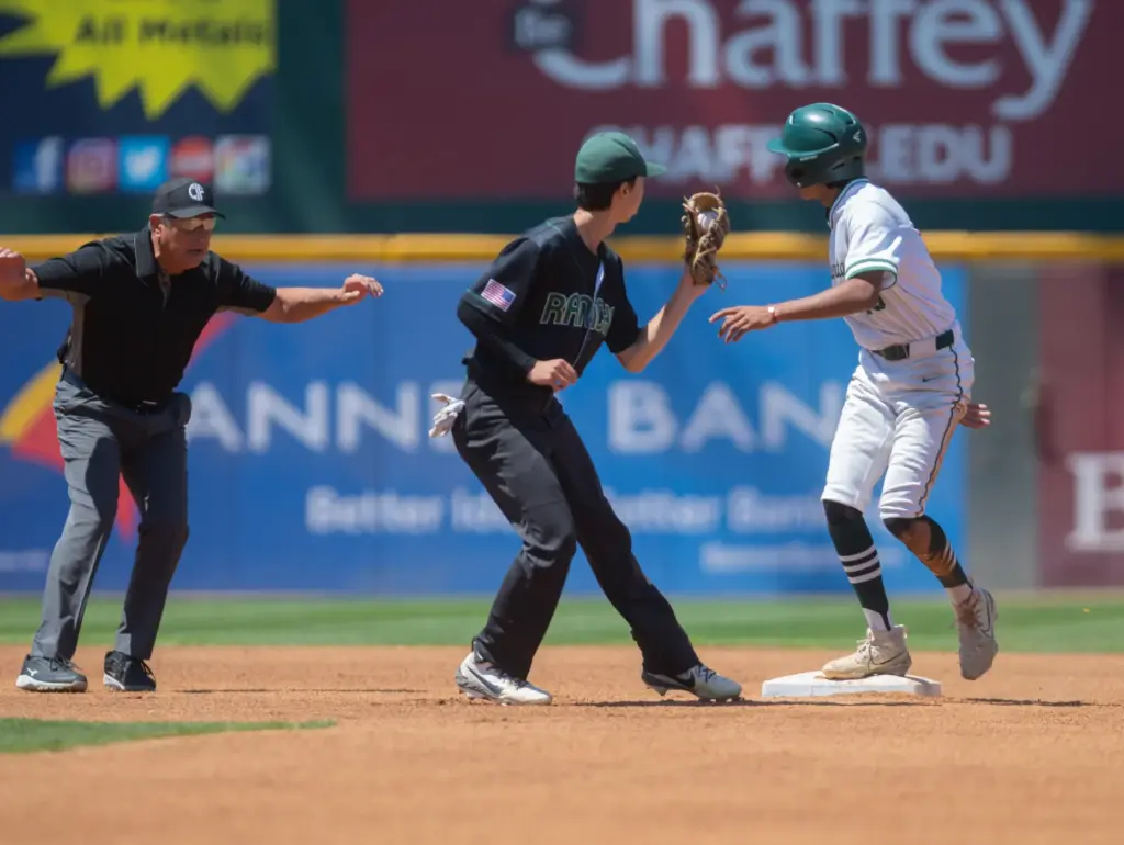 Schurrâs James Borbon, (#16), is called safe ar second base...