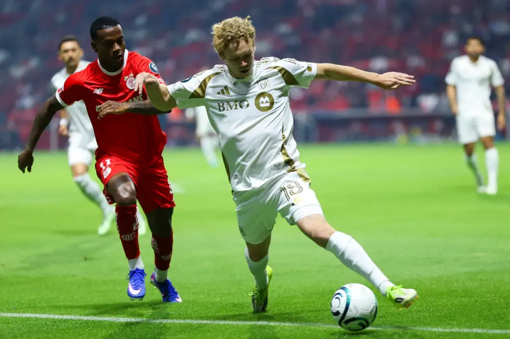 LAFC’s Jacob Shaffelburg battles for the ball with Toluca FC’s...