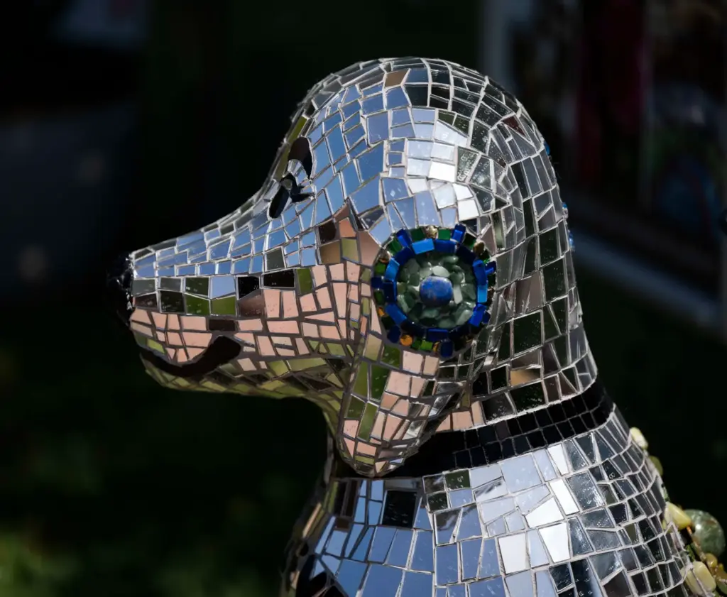 The mosaic dog sculpture titled Parker is part of the...