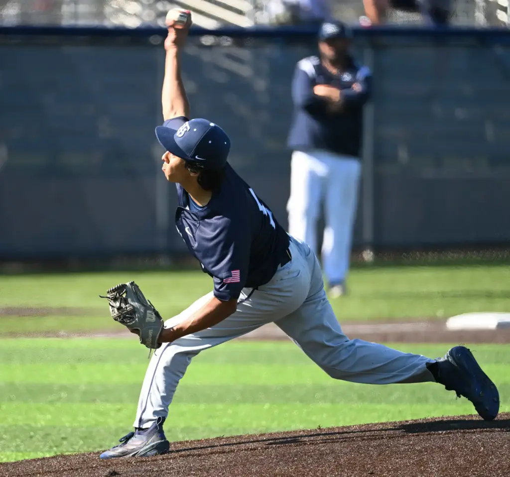 Christian Avalos (5) of Trabuco Hills pitches against Newport Harbor...