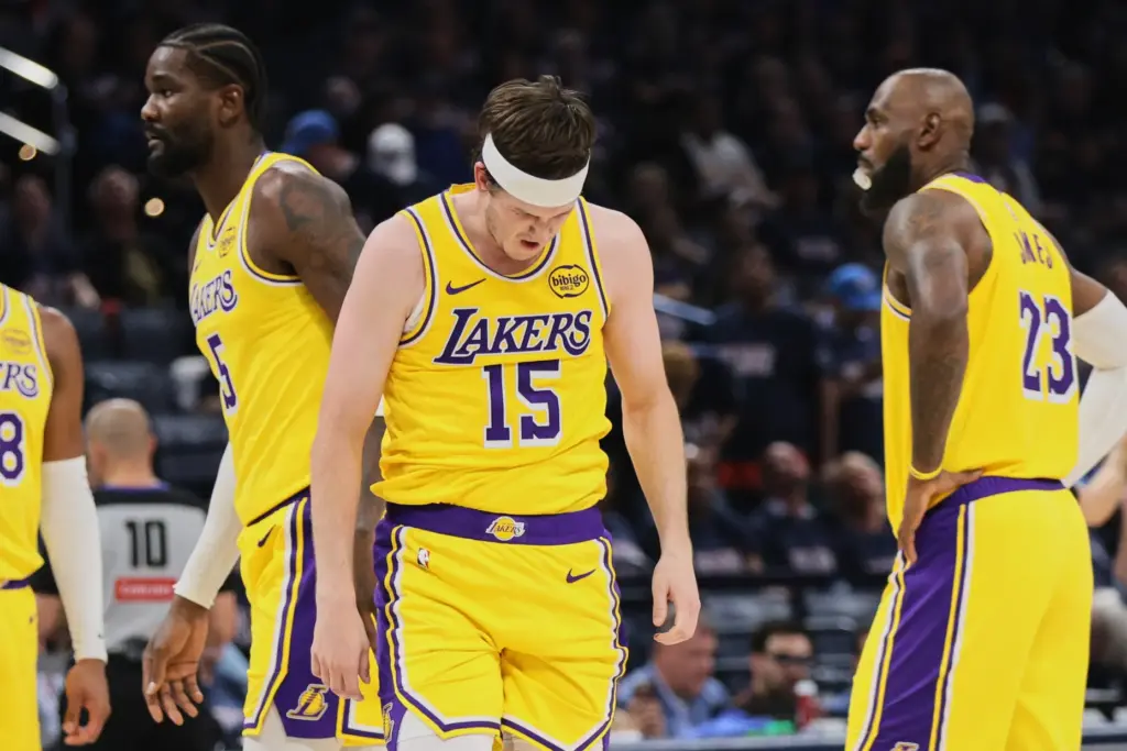 Los Angeles Lakers guard Austin Reaves (15) recovers after being...