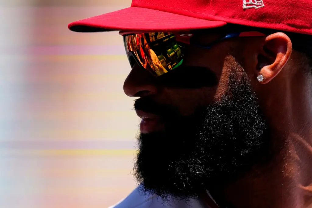 Angels outfielder Jo Adell talks to fans before a game...