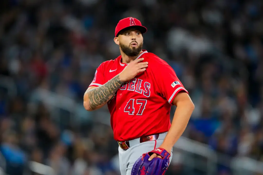 Angels pitcher Alek Manoah rubs his shoulder during the eighth...