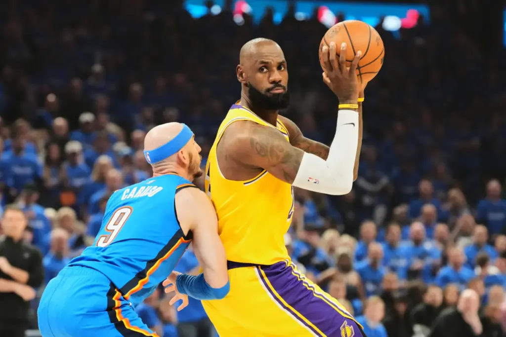 Lakers star LeBron James, right, considers his options as Oklahoma...