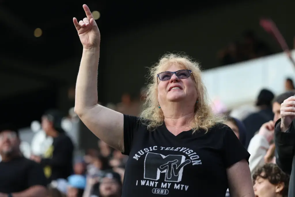 A fan celebrates after Angel City FC scores against the...