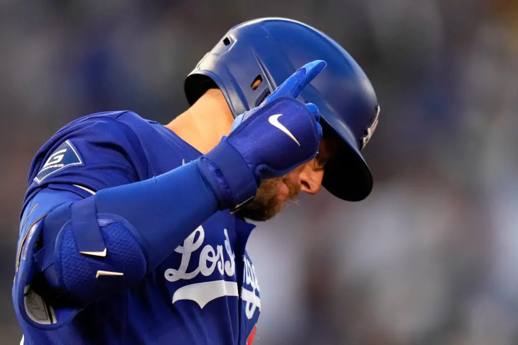 The Dodgers’ Max Muncy gestures after hitting a solo home...
