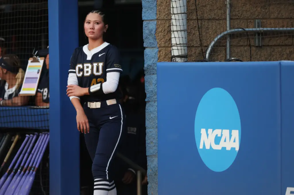 California Baptistâs Kenzie Farrier-Pilon walks out of the dugout before...