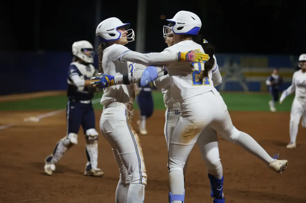 UCLAâs Rylee Slimp, center left, celebrates alongside Aleena Garcia (21)...