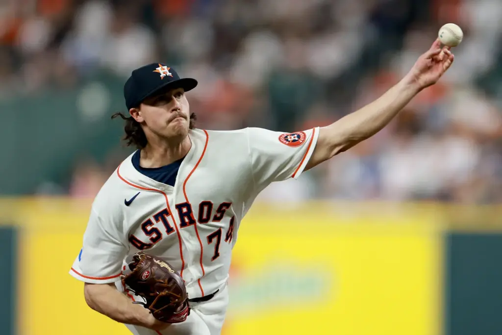 Houston Astros relief pitcher Bryan King throws to the plate...