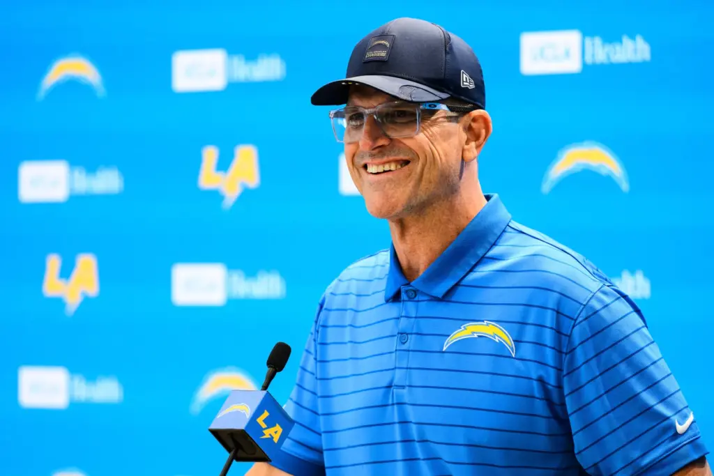Chargers head coach Jim Harbaugh speaks to reporters before the...