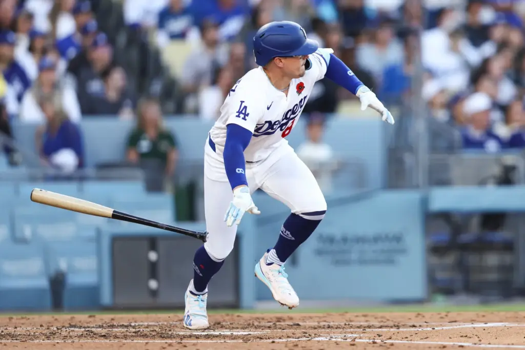 The Dodgers’ Enrique HernÃ¡ndez drops his bat after hitting an...