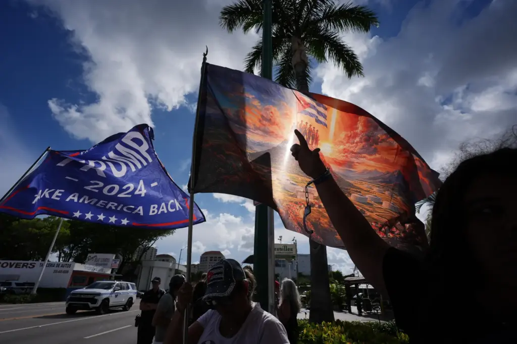 Jose Miguel Hernandez, 14, right, wears handcuffs to represent freedom...