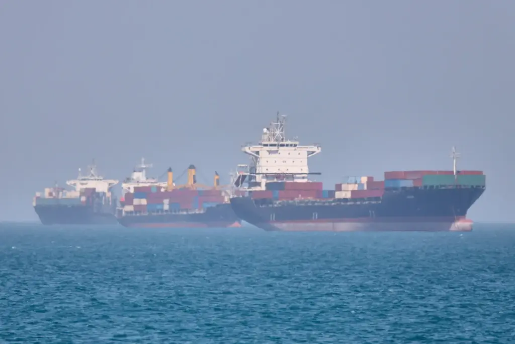 Container ships sit at anchor in the Strait of Hormuz.