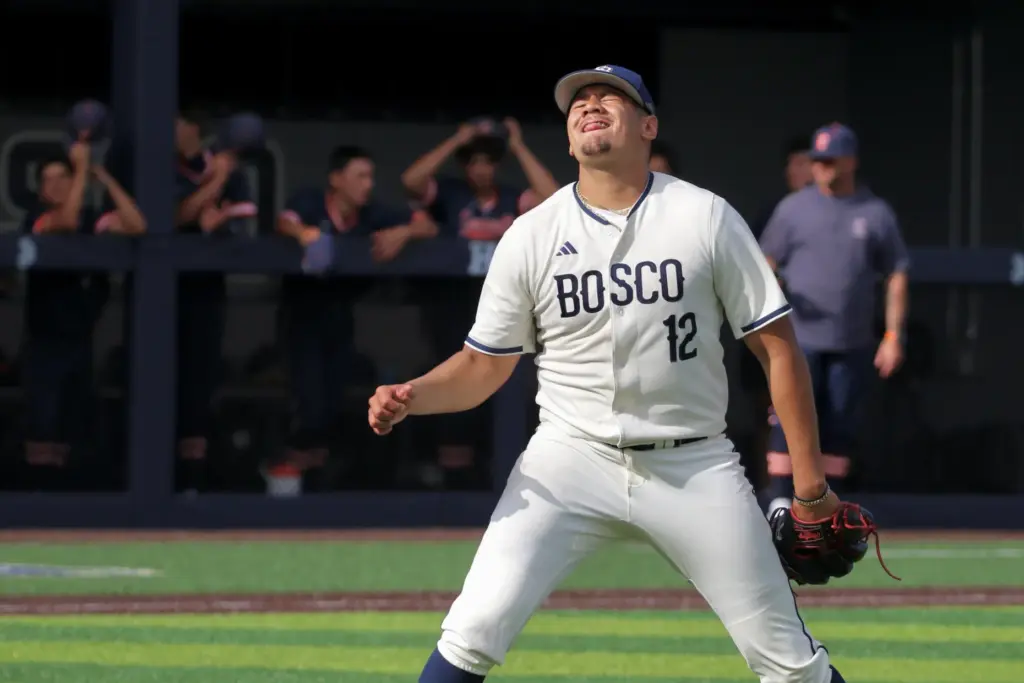 St. John Bosco starter Julian Garcia reacts after getting the...