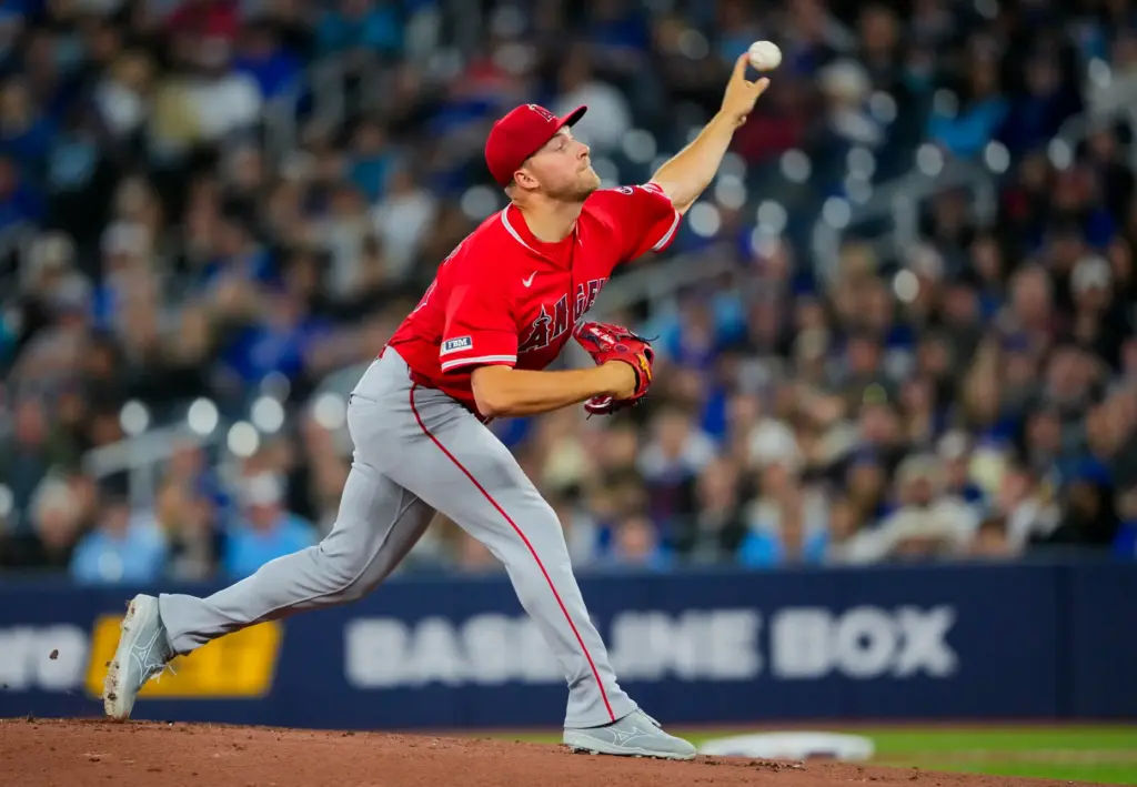 Angels starting pitcher Reid Detmers throws to the plate during...
