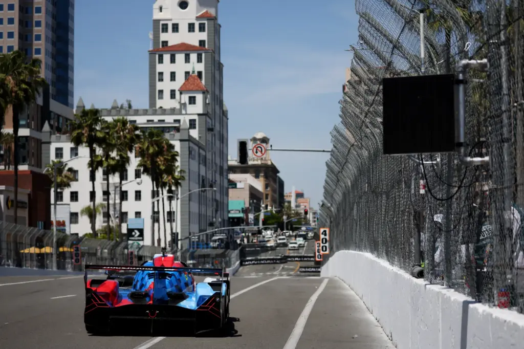 A GTP car hustles around the track in the IMSA...
