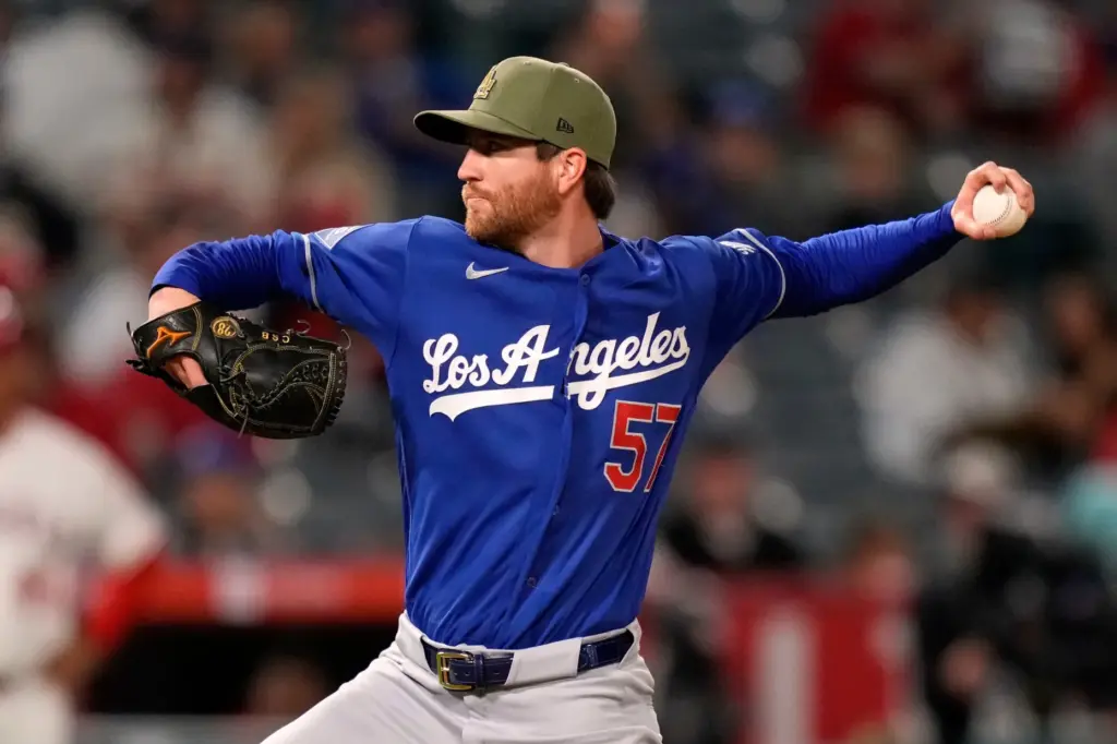 Dodgers relief pitcher Charlie Barnes throws to the plate during...