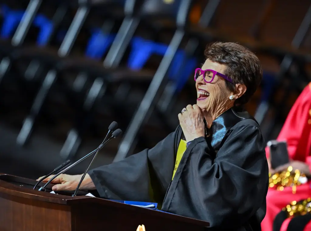 Billie Jean King laughs as she delivers the keynote address...