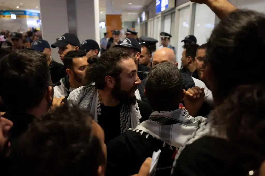 An activist from the Global Sumud Flotilla talks with the...