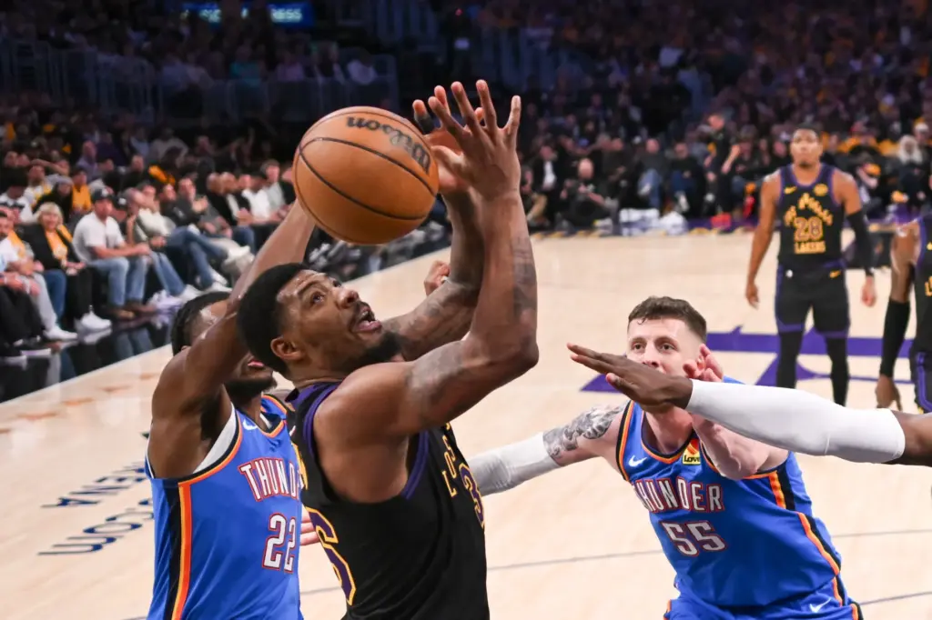 Lakers guard Marcus Smart, middle, is fouled by the Oklahoma...