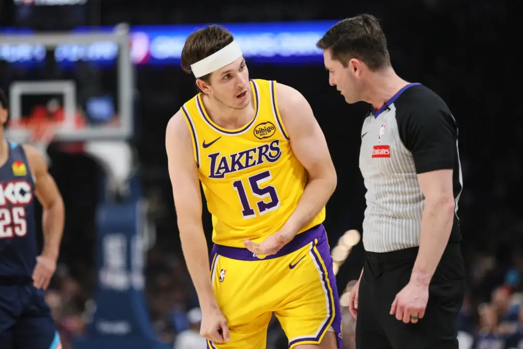 Los Angeles Lakers guard Austin Reaves talks with referee Ben...