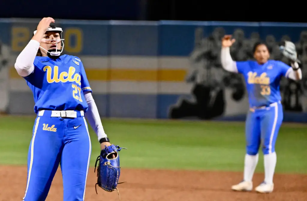 Starting pitcher Taylor Tinsley #23 and second baseman Kaniya Bragg...