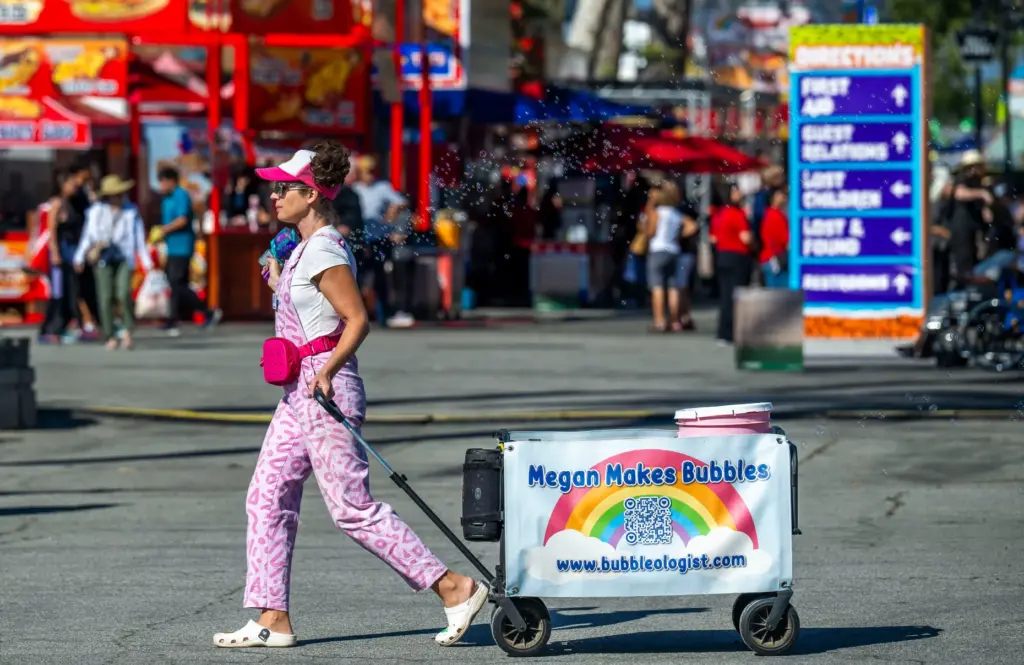 Megan Mciver makes bubbles as she walks with her Megan...