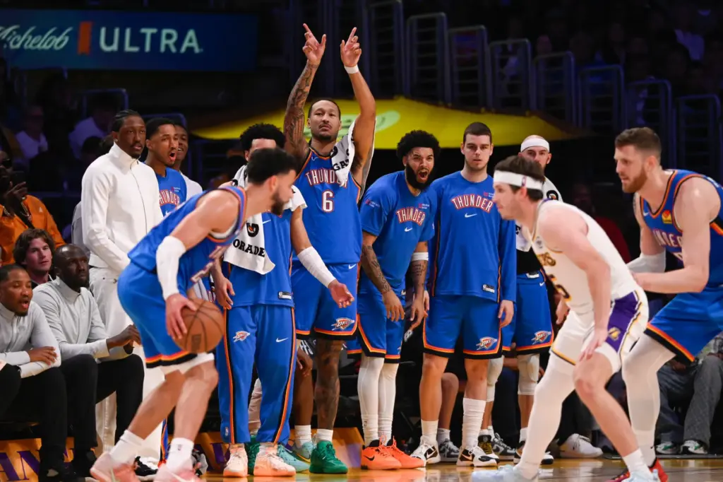 Players on the Oklahoma City Thunder bench bench celebrate their...
