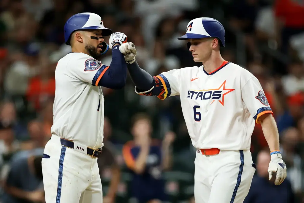 The Houston Astros’ Zach Cole, right, is congratulated by teammate...