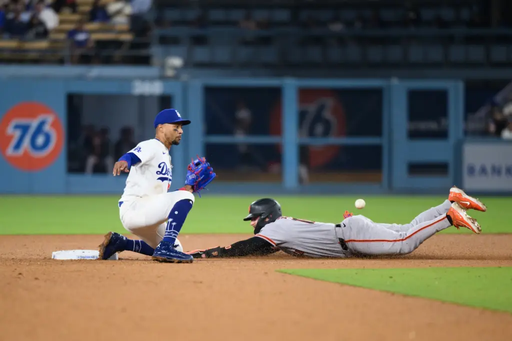 The San Francisco Giants’ Casey Schmitt, right, steals second base...