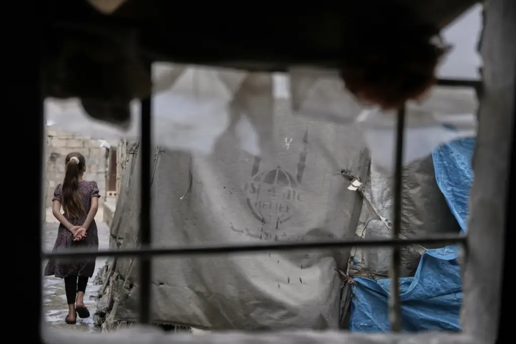 A girl walks through al-Karama camp.