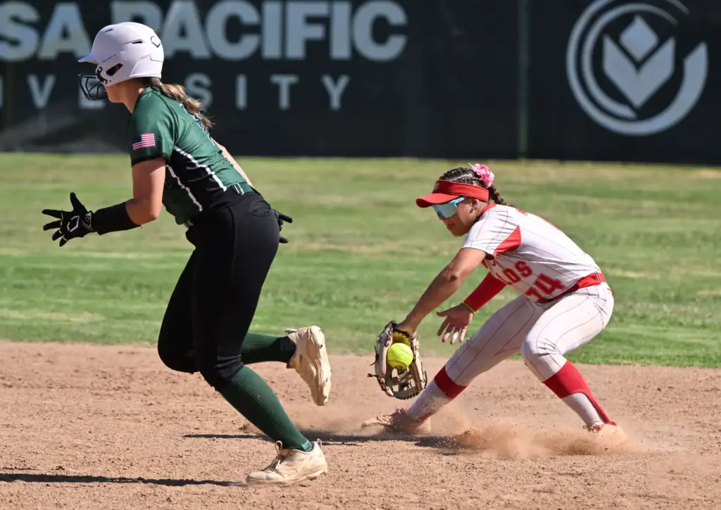 Shortstop Gigi Bojorquez #74 of the Whittier Christian Heralds fields...