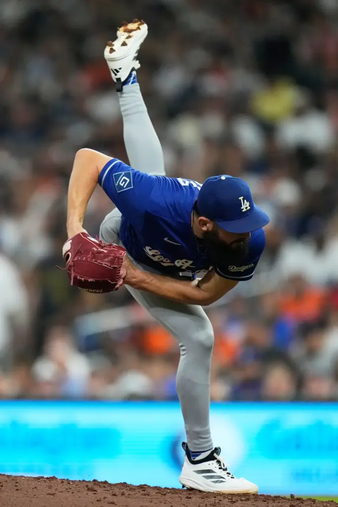 Dodgers relief pitcher Alex Vesia throws to the plate during...