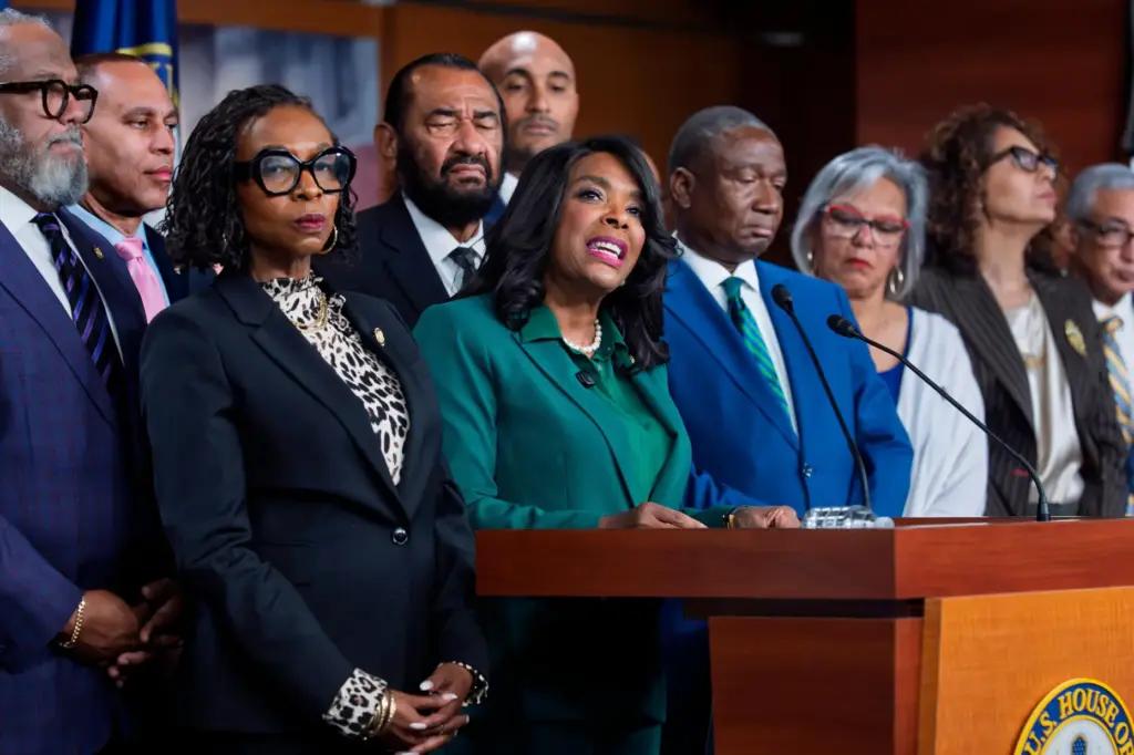 Rep. Terri Sewell, D-Ala., is surrounded by members of the Congressional Black Caucus.
