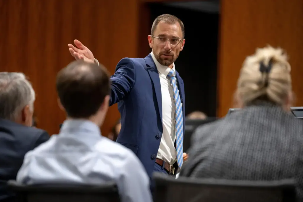 Deputy Utah County Attorney Ryan McBride gestures to the defense table.