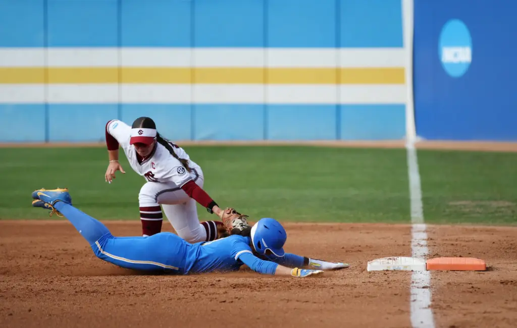 UCLAâs Aleena Garcia is tagged out by South Carolinaâs Arianna...