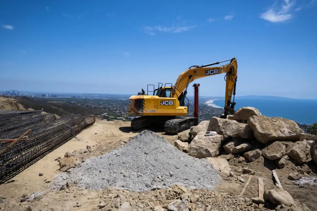A building site is being prepped for 55â caissons using...
