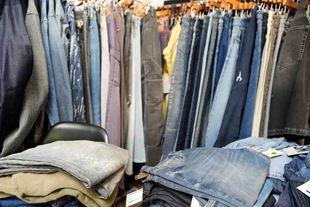 Piles of denim sit in the showroom of BPD Washhouse,...