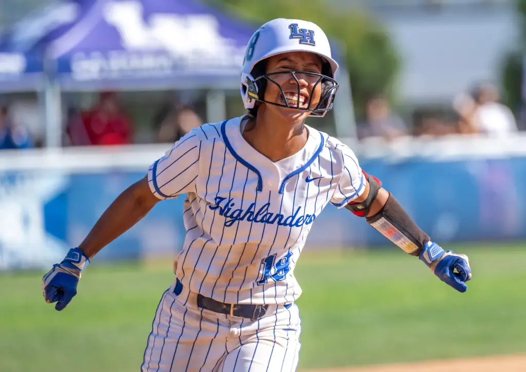La Habra outfielder Georgia Rickenbacker celebrates as she rounds third...