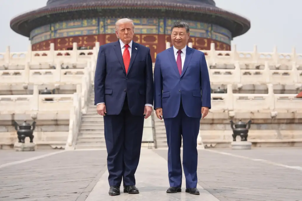 President Donald Trump stands with Chinese President Xi Jinping at the Temple of Heaven.
