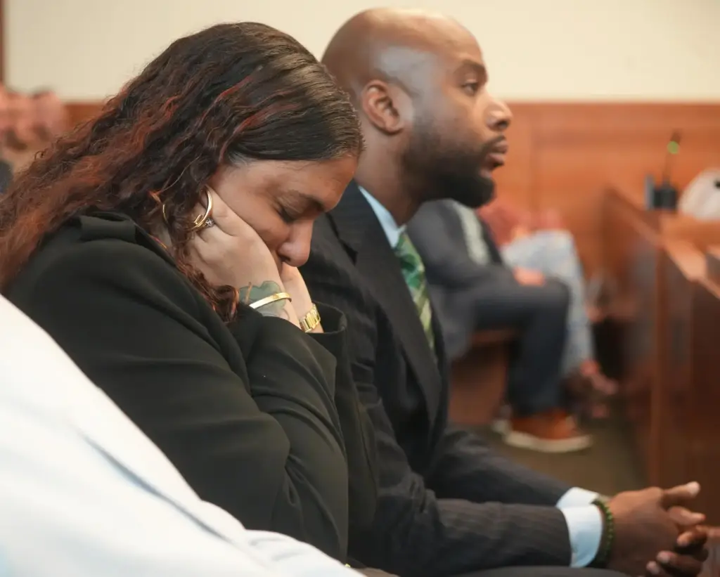 The mother of Casey Goodson Jr., Tamala Payne, covers her...