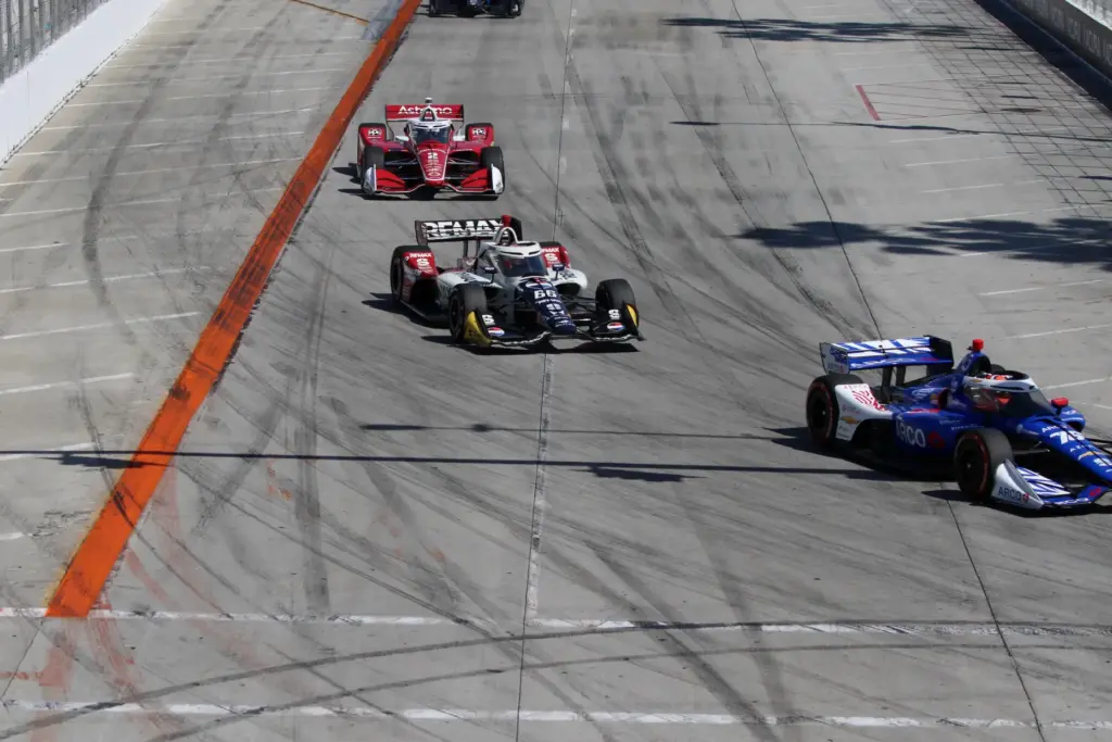 IndyCars make the first turn off Shoreline Drive during the...