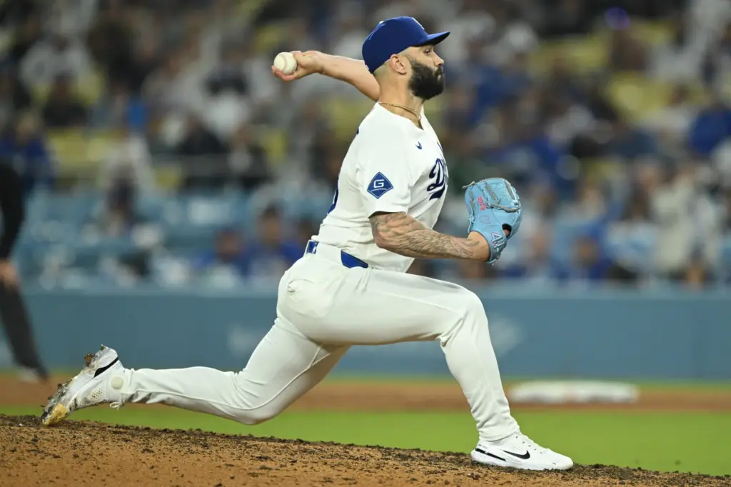 Dodgers relief pitcher Tanner Scott throws to the plate during...