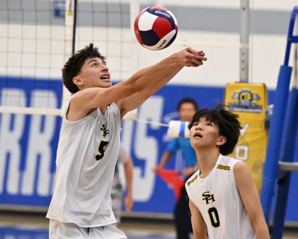 Parker Mesnik #5 of the Sunny Hills Lancers returns a...